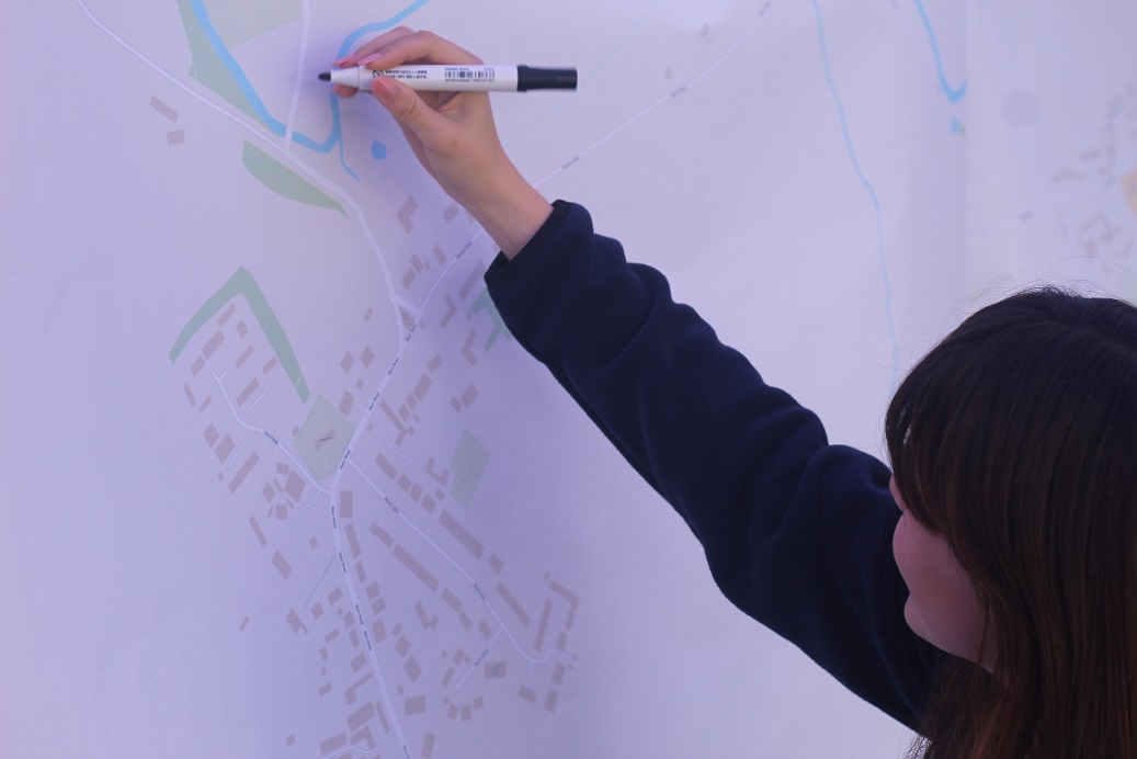 Close up image of someone marking up an area on a map