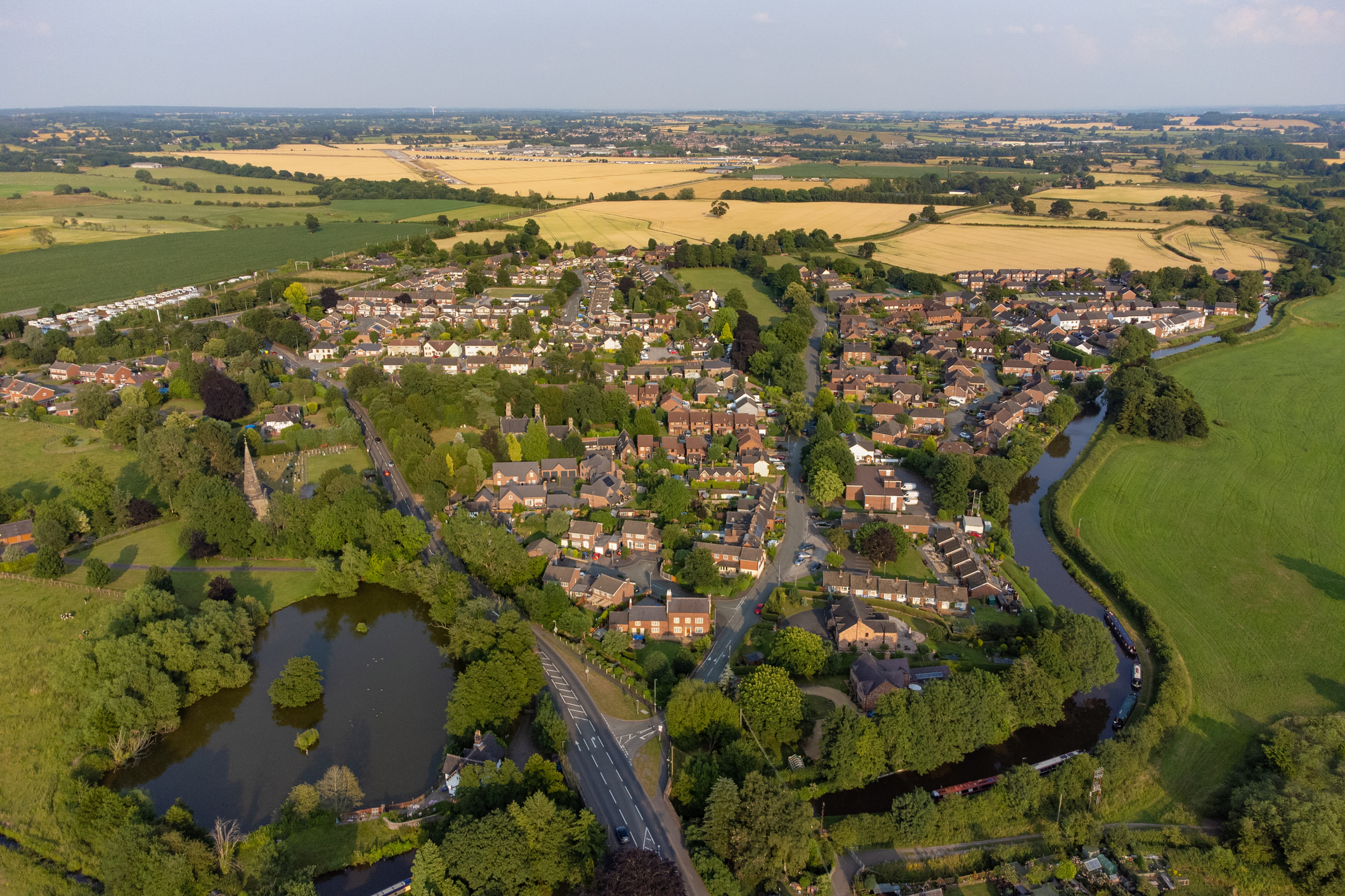 Aerial image of a town with a river flowing nearby