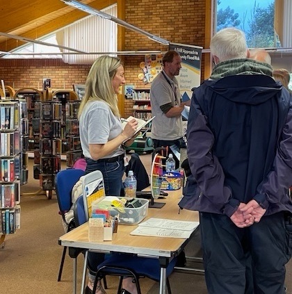 Community engagement event with members of the FAIR team in discussion with the public